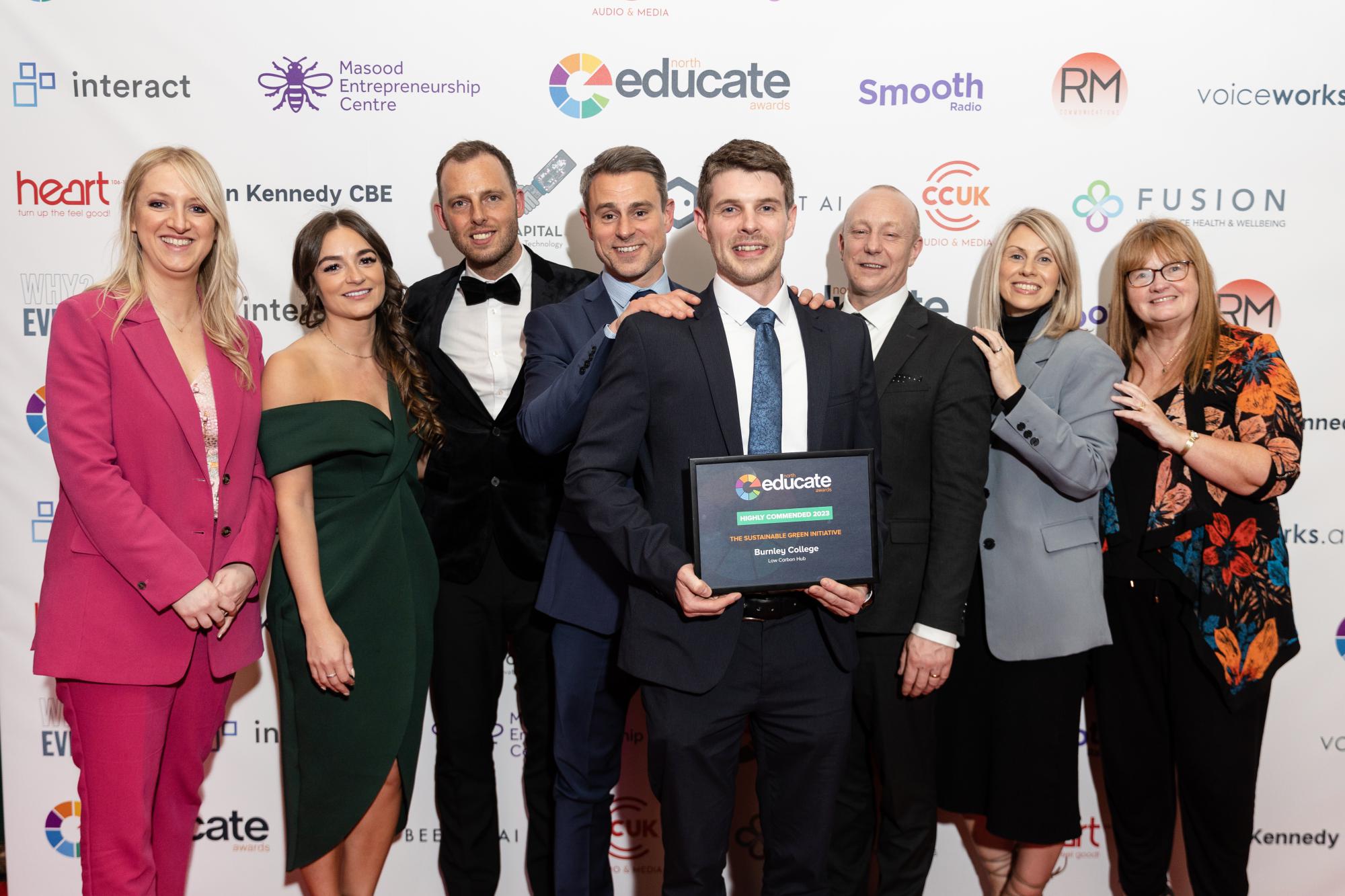 A group of tutors from Burnley College celebrate winning another award