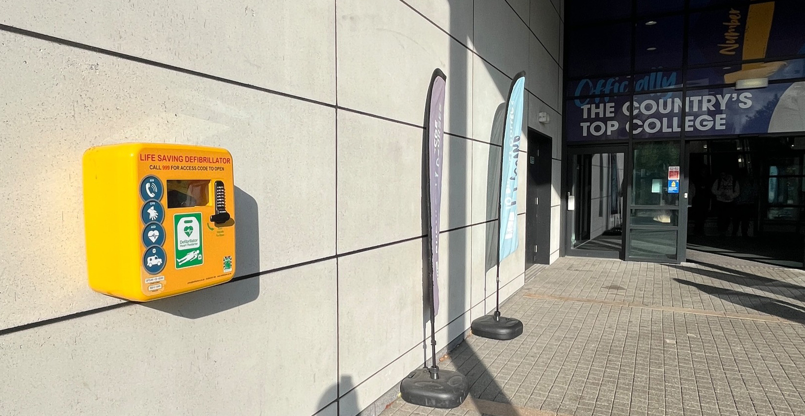 A defibrillator mounted on a wall