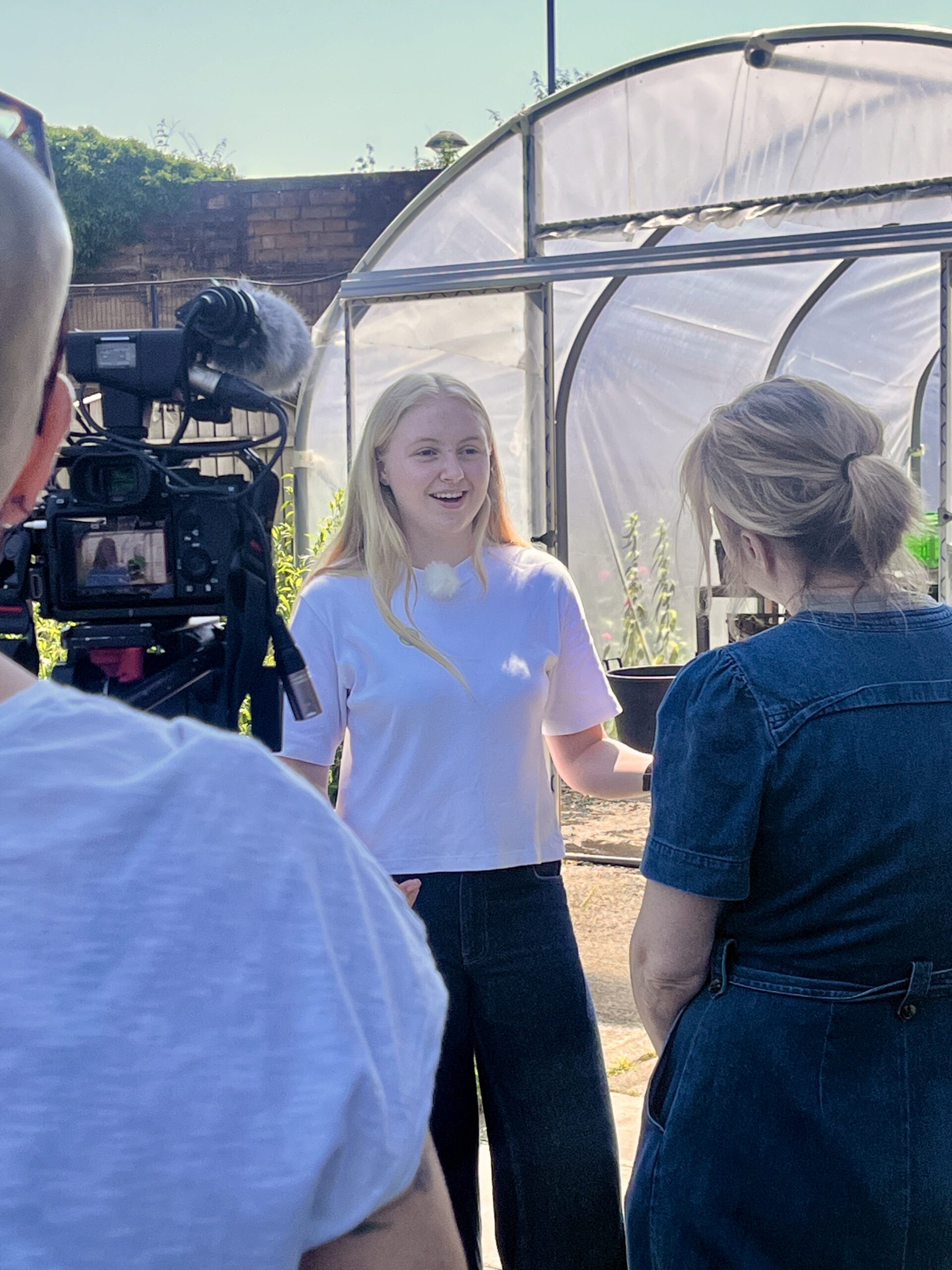 20260626_102858984_iOS A student excitedly chats to a reporter on camera